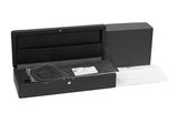 an image of a black box with a pen and paper in it