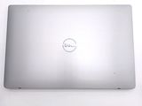 dell laptop computer with dell logo on the screen on a white surface