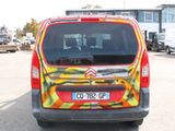 a van that has been painted with a design on it