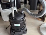 a vacuum that is sitting on the floor in a room