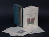 a book that is opened to reveal a picture of trees