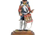 a toy soldier with a drum and drum stand on a wooden base