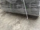 several rolls of wire are stacked on top of each other in a warehouse