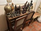 a table with a lot of figurines on top of it