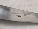 a close up of a knife on a table