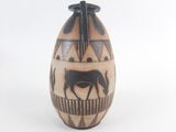 an image of a vase with a horse on it
