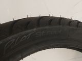 a close up of a tire on a white surface