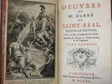 an open book with a picture of a man riding a horse and another man riding a horse