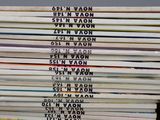 many books stacked on top of each other on a table