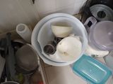 a lot of dishes that are sitting on the kitchen counter