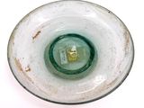 a close up of a glass bowl on a white surface