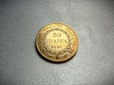 a close up of a coin on a table with a black background