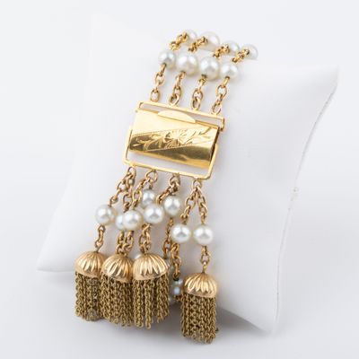 Bracelet 4 rangs terminé par des pampilles, or 18K et perles…