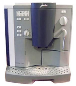 une image représentant une machine à café sur laquelle est posée une tasse