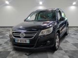 a picture of a black vw passat parked in a garage