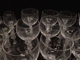 many empty wine glasses sitting on a table
