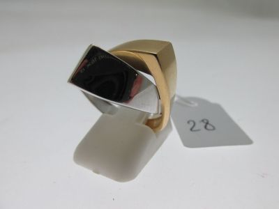 a gold ring with a black stone on it