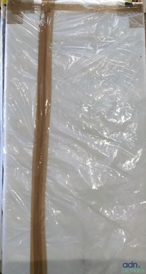 two wooden sticks sticking out of a plastic bag