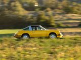 a yellow car that is driving down the road