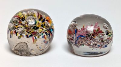 two marbles that are sitting next to each other