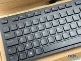a black keyboard sitting on top of a cardboard box