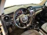 the interior of a small car with a steering wheel and dashboard