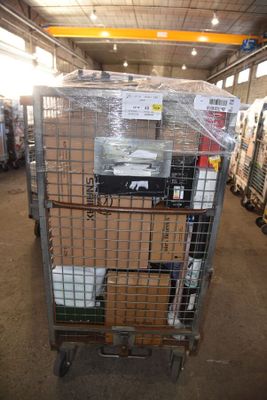 a large metal cage with a lot of items inside of it