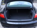 the trunk of a black car with its open doors open
