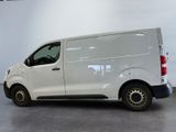 a picture of a white van parked in a garage