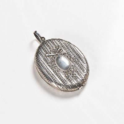 an image of a silver locke with a stone in the center