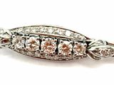 a close up of a broochet with diamonds on it