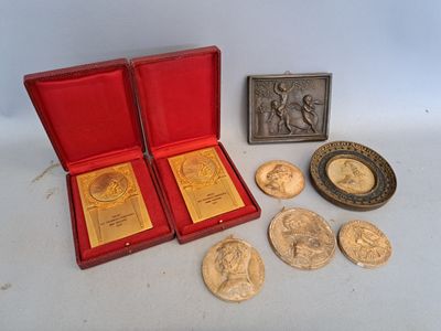 a red box with some gold coins and a picture of a woman