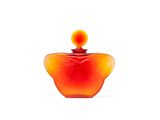 an orange glass perfume bottle with a red top on a white surface