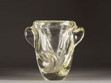 a glass vase that is sitting on a table
