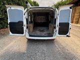 a white van that is parked on the side of the road