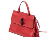 a red handbag on a white background