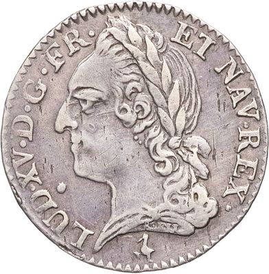 gros plan d'une pièce de monnaie sur laquelle figure une tête de femme