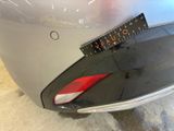a close up of a car ' s tail light with a sticker on it