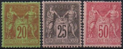 a group of four stamps with different colors and designs on them
