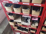 many boxes of assorted items on a red shelf