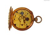 a gold pocket watch with a chain around it