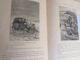 an open book with pictures of people and animals on it