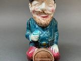 an image of a ceramic figurine of a man with a beard and a hat