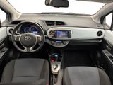 the interior of a small car with a steering wheel and dashboard