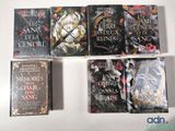 five books that are sitting on top of a table
