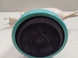 a close up of a small speaker on a table