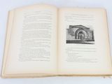 an open book with a picture of a building on it