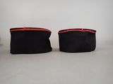 pair of black and red purses on white background