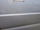 a sign on the side of a white car