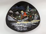 an image of a black plate with a picture of a man on skis